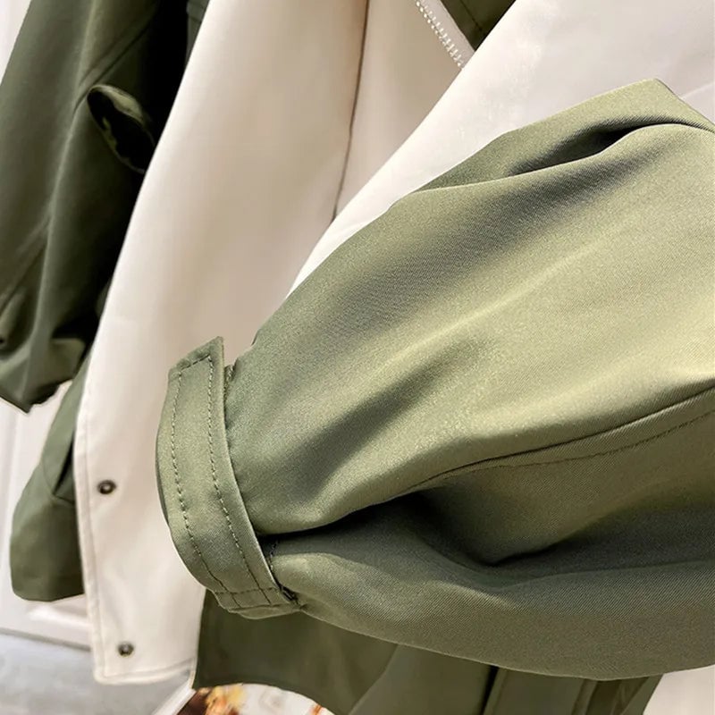 Aurelia windbreaker jacket in green showing drawstring waist tie detail
