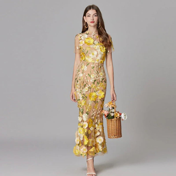 Front view of the Aurelia sleeveless sheer mesh maxi dress with 3D floral appliqués in yellow