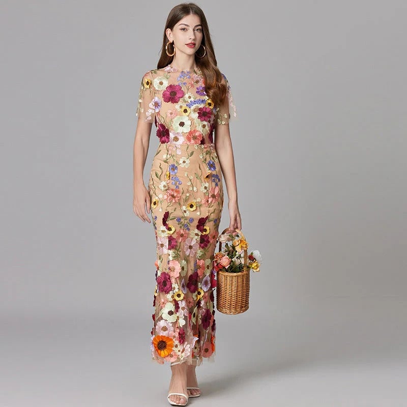 Back view of the Aurelia sheer mesh column maxi dress with dimensional floral details in yellow