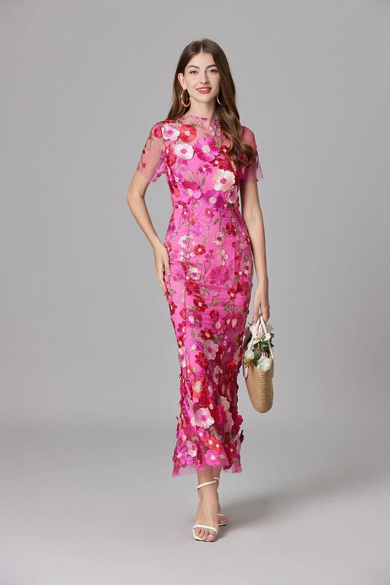 Model wearing the Aurelia sleeveless maxi dress in beige with 3D floral appliqués