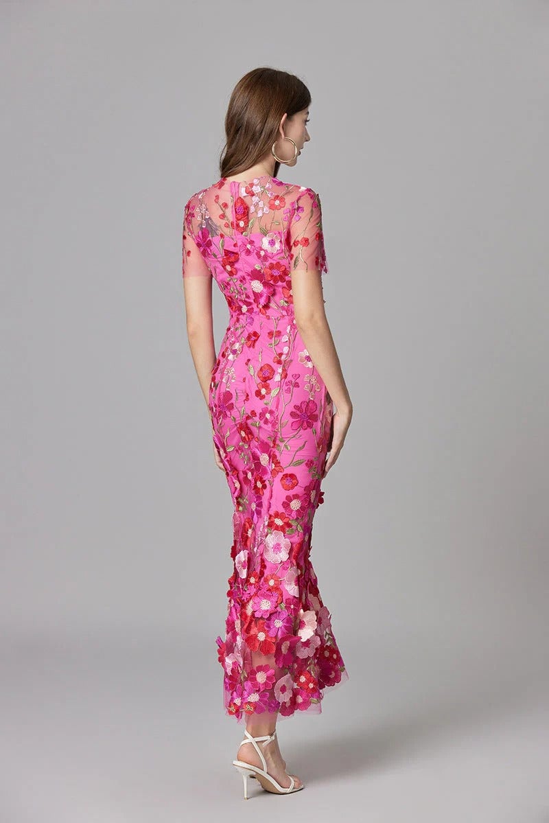 Close-up of dimensional flower appliqués on the Aurelia maxi dress in beige