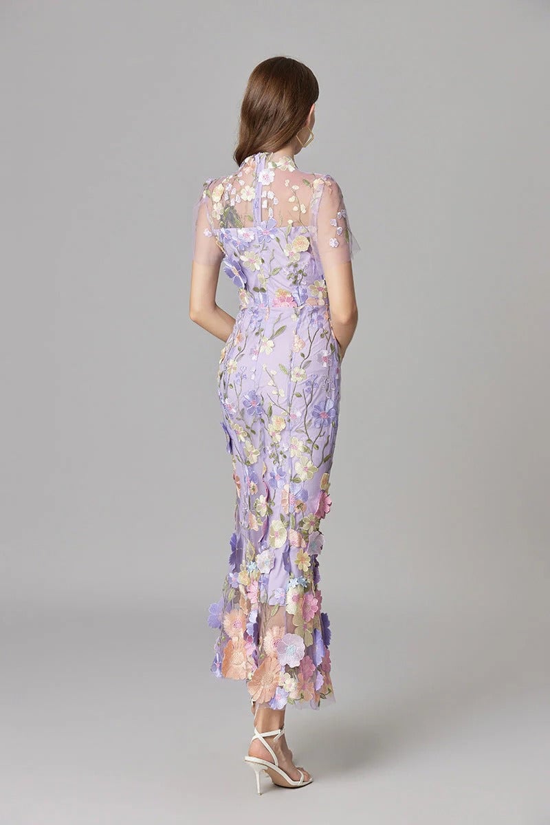Close-up of 3D floral appliqués on the Aurelia maxi dress in dark pink