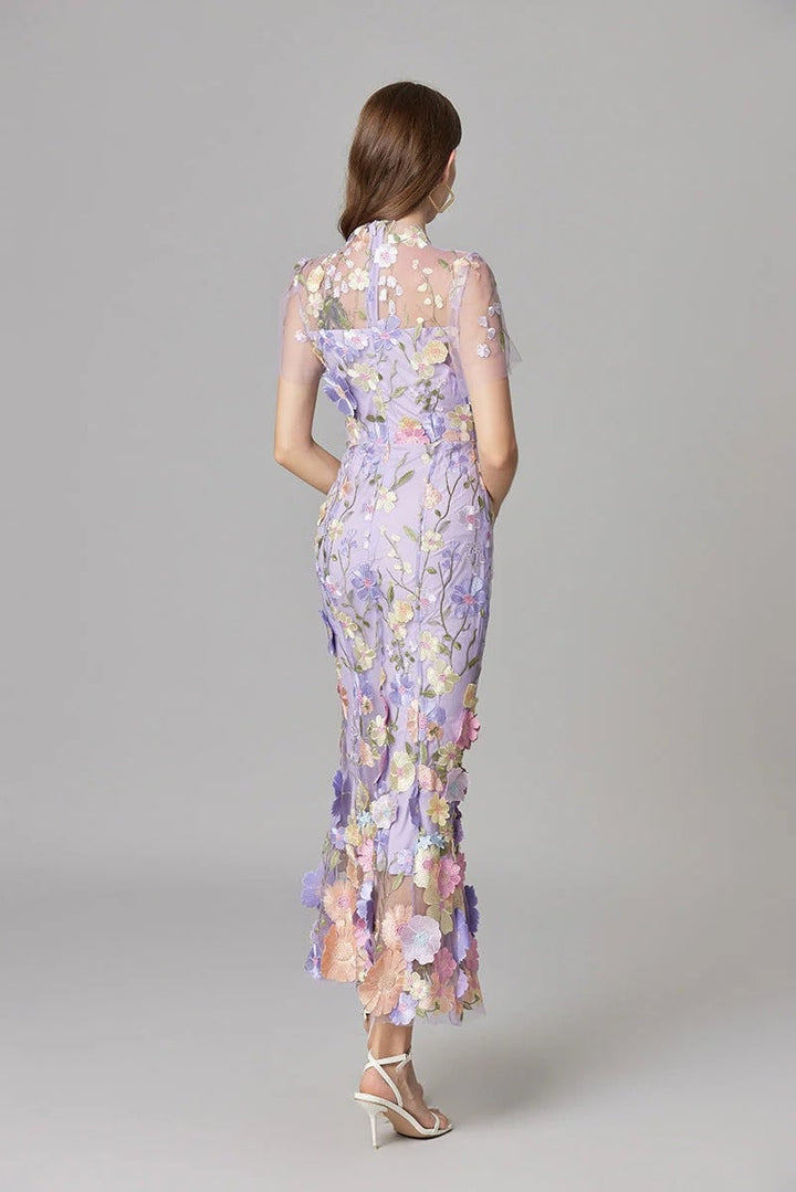 Close-up of 3D floral appliqués on the Aurelia maxi dress in dark pink