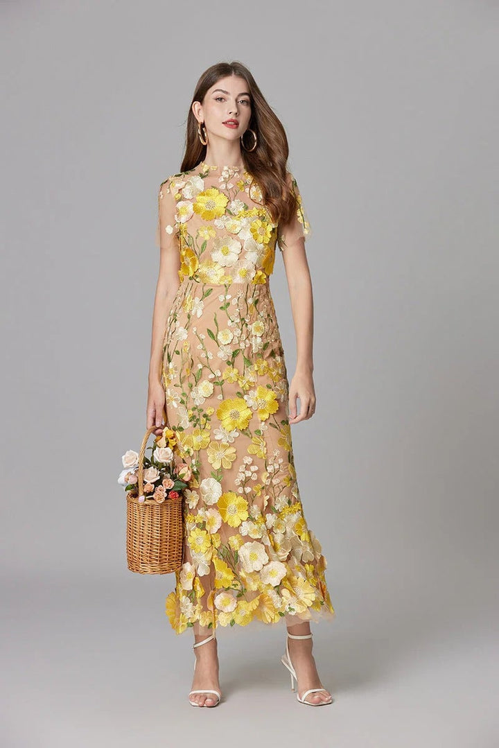 Model in the Aurelia dark pink column maxi dress with dimensional floral detailing