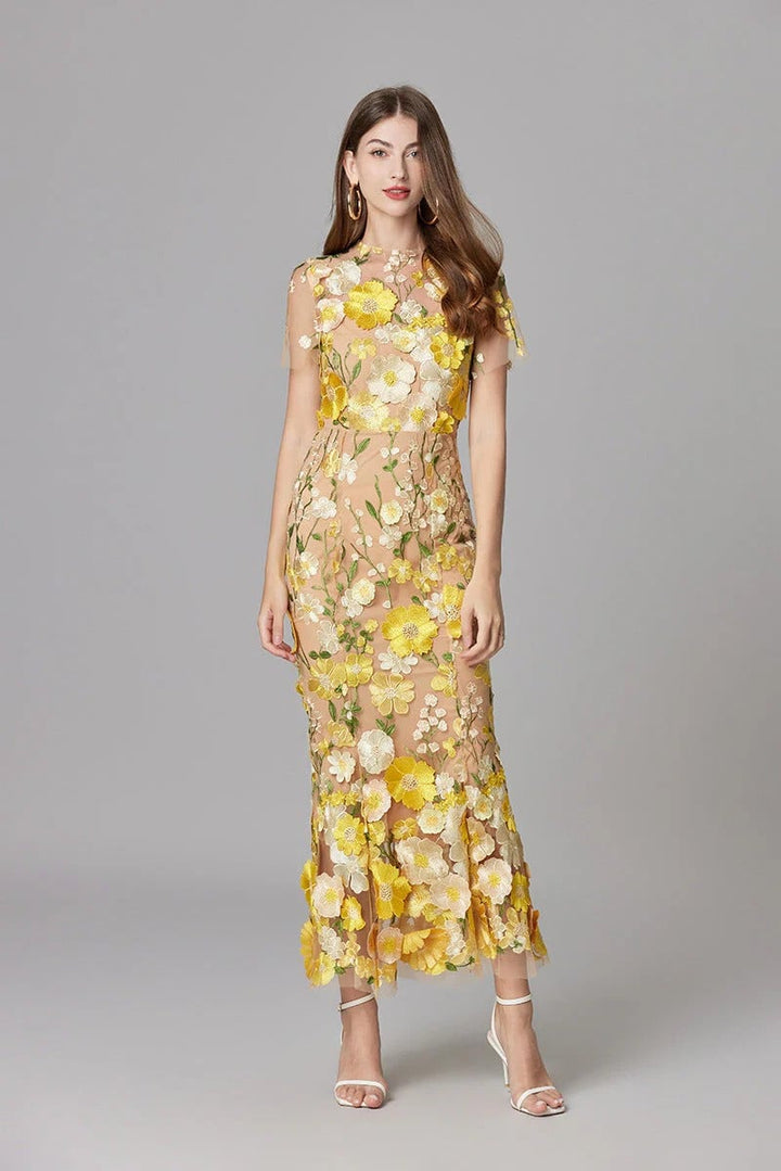 Full-length styling shot of the Aurelia 3D floral maxi dress paired with strappy heels