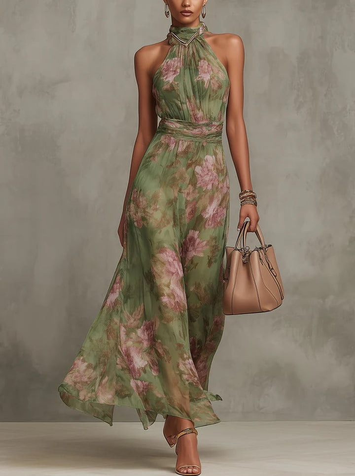 Aurelia green and pink floral halter neck maxi dress shown from the front on a model, flowing to the ankles