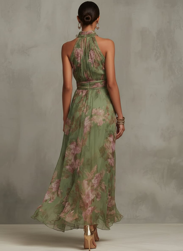 Back view of the Aurelia floral halter maxi dress showing the tie neck detail in green botanical print