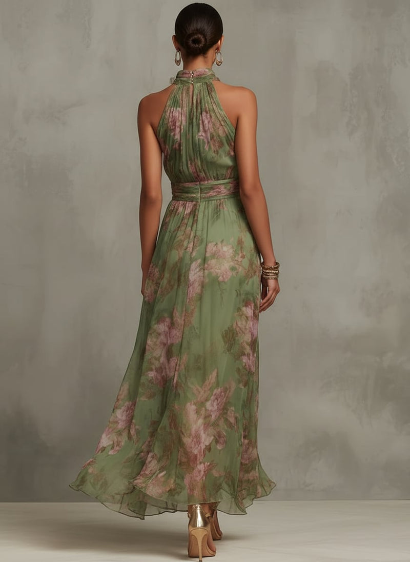 Back view of the Aurelia floral halter maxi dress showing the tie neck detail in green botanical print
