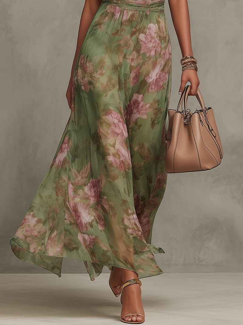 Close-up detail of the Aurelia maxi dress fabric showing the romantic green and pink botanical floral print