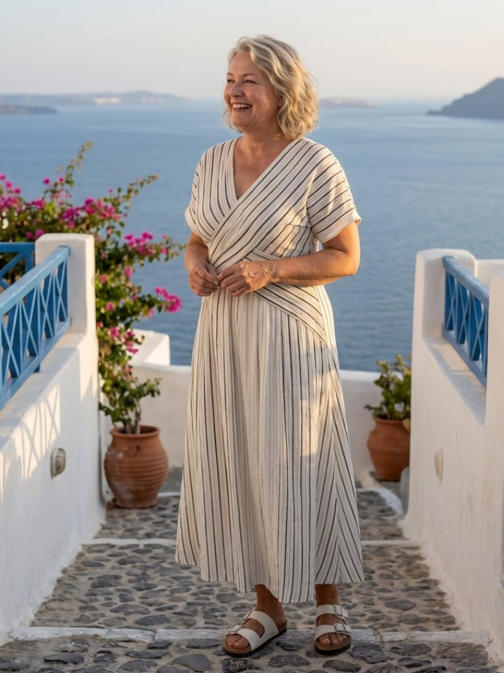 Close-up of the adjustable cross-waist tie and stripe pattern on the Aurelia wrap midi dress
