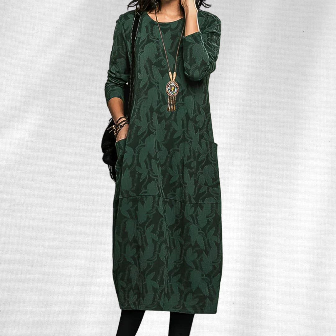 Woman wearing an elegant crewneck winter dress with subtle floral details in a relaxed flattering silhouette