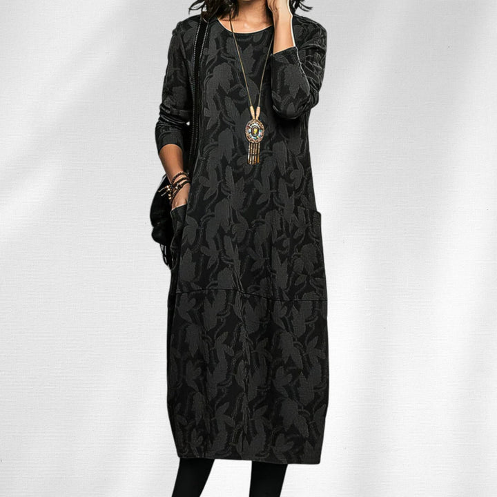 Side view of the elegant crewneck dress highlighting the relaxed fit and hidden pocket detail