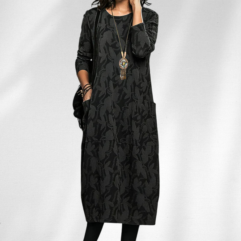Side view of the elegant crewneck dress highlighting the relaxed fit and hidden pocket detail