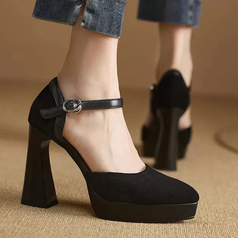 Aurore platform block heel pump in black with slim ankle strap buckle closure, front view