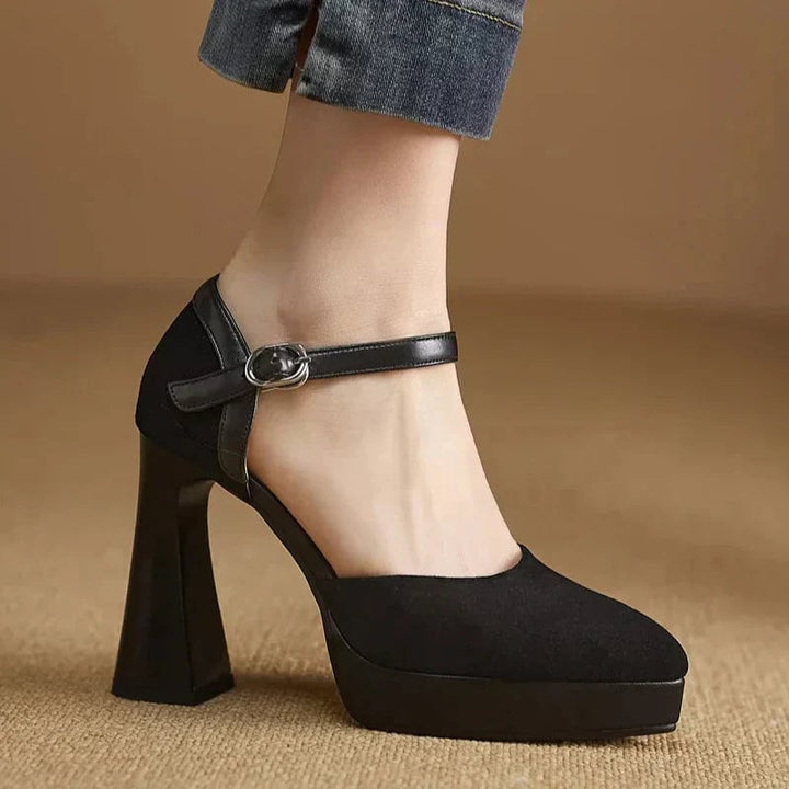 Aurore platform block heel pump in black, side profile showing chunky heel and platform base
