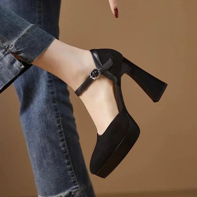 Aurore black platform pump, rear view highlighting block heel height and ankle strap