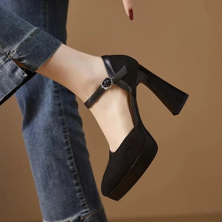 Aurore black platform pump, rear view highlighting block heel height and ankle strap