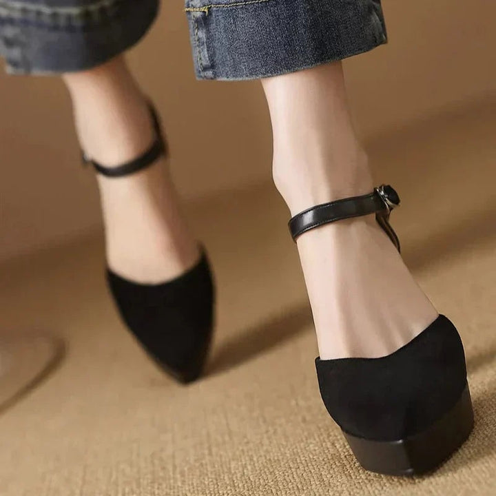 Aurore platform block heel pump in black styled with tailored trousers, three-quarter view