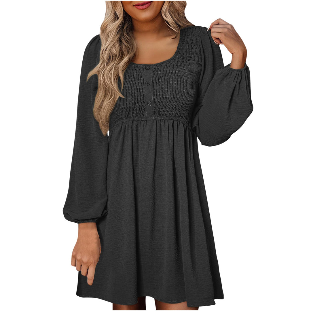 Side view of smocked mini dress showing A-line skirt and balloon sleeve detail