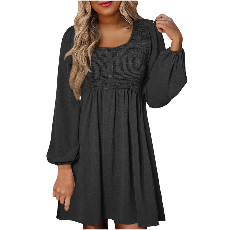 Side view of smocked mini dress showing A-line skirt and balloon sleeve detail