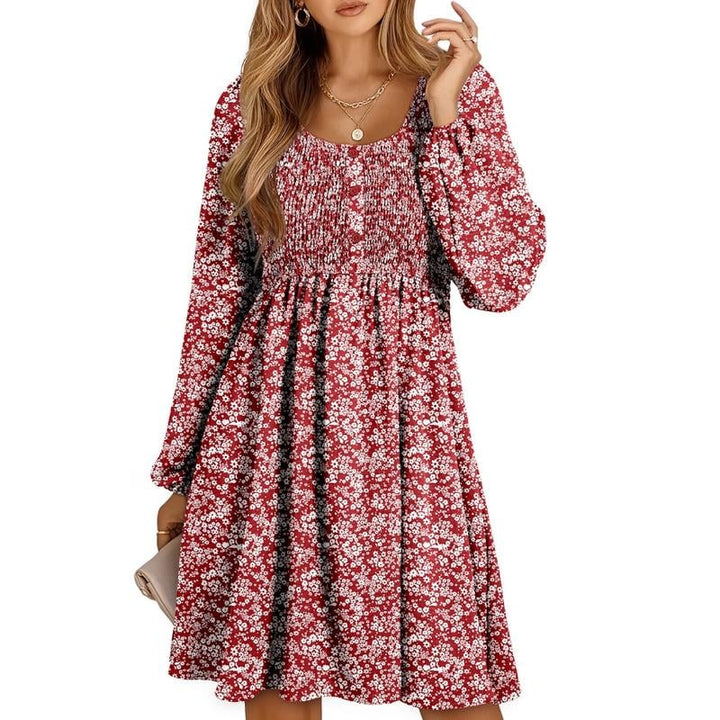 Smocked mini dress styled in navy blue showing full-length silhouette