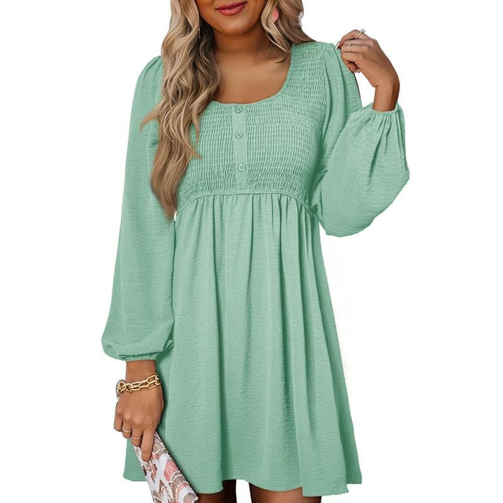 Front view of smocked empire waist mini dress in light blue