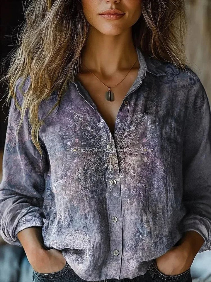 Flat lay of women's vintage floral button-down shirt showing full print and collar detail