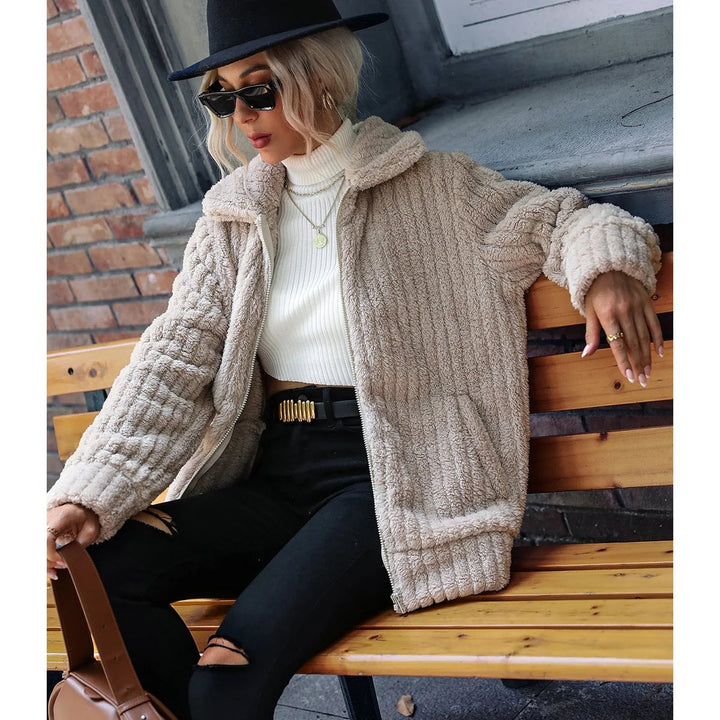 Flat lay of the Ava elegant plush jacket in apricot showing shoulder width and overall length