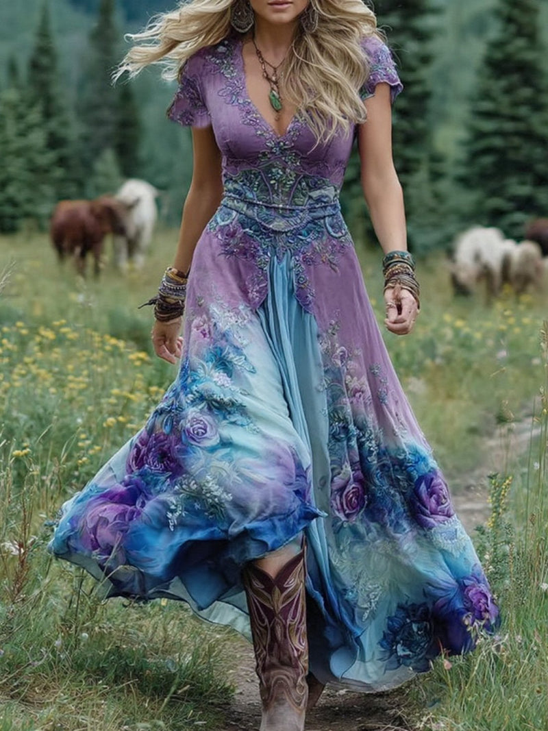 Woman wearing a flowing gradient floral maxi dress in purple with a soft ombré print, full-length front view