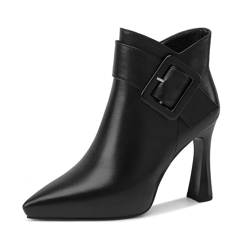 Pair of Aveline buckle heel boots in beige and black displayed side by side