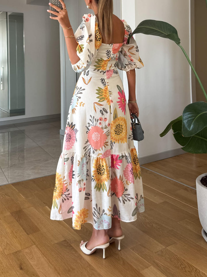 Front view of a floral print puff sleeve midi dress with square neckline in multicolor print