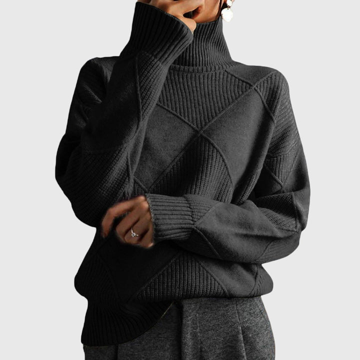 Model wearing a gray turtleneck sweater with a smooth drape and comfortable fit