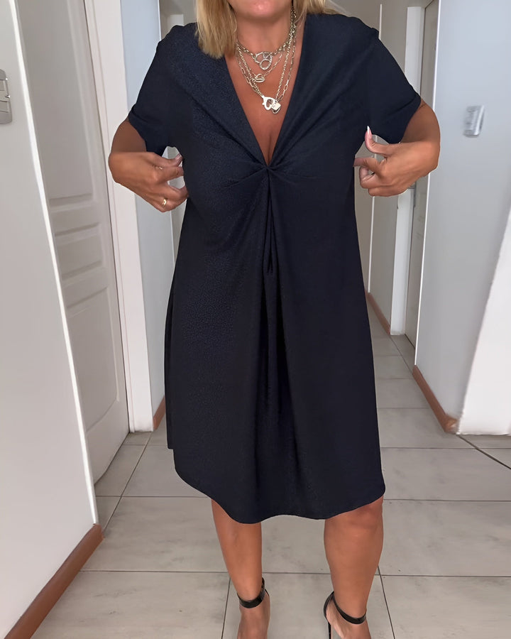Woman wearing the Avery black V-neck ruched evening dress, front view showing tummy control waist detailing