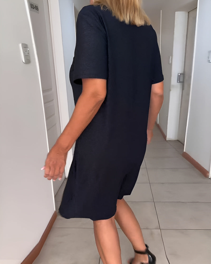 Side view of the Avery black ruched evening dress showing the flattering silhouette and graceful drape