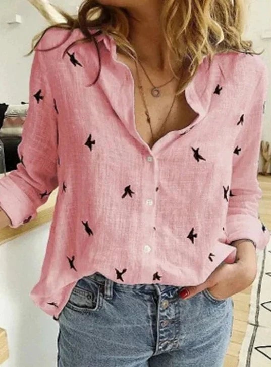Avery bird print blouse in blue styled with white trousers