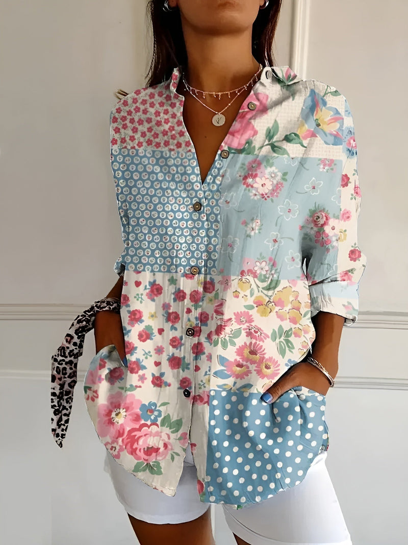 Close-up detail of the Avril blouse floral print pattern in soft blue tones