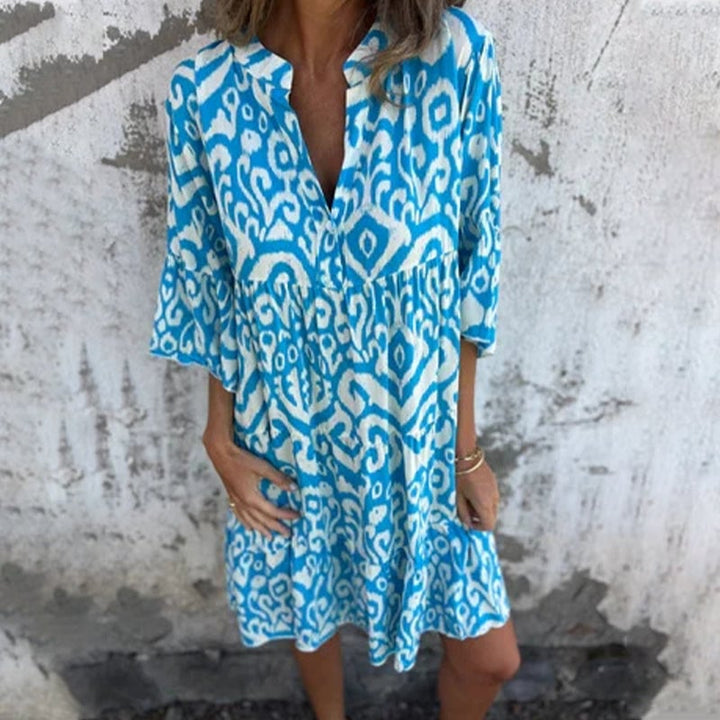 Azalea dress in light blue with flattering draped bodice and relaxed fit