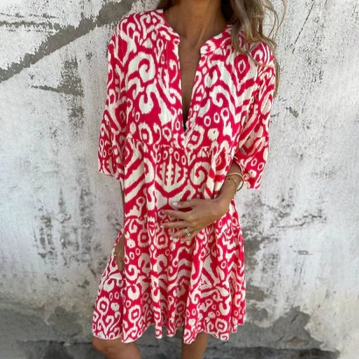 Azalea printed dress in rose pink showcasing the flowing skirt and elegant silhouette