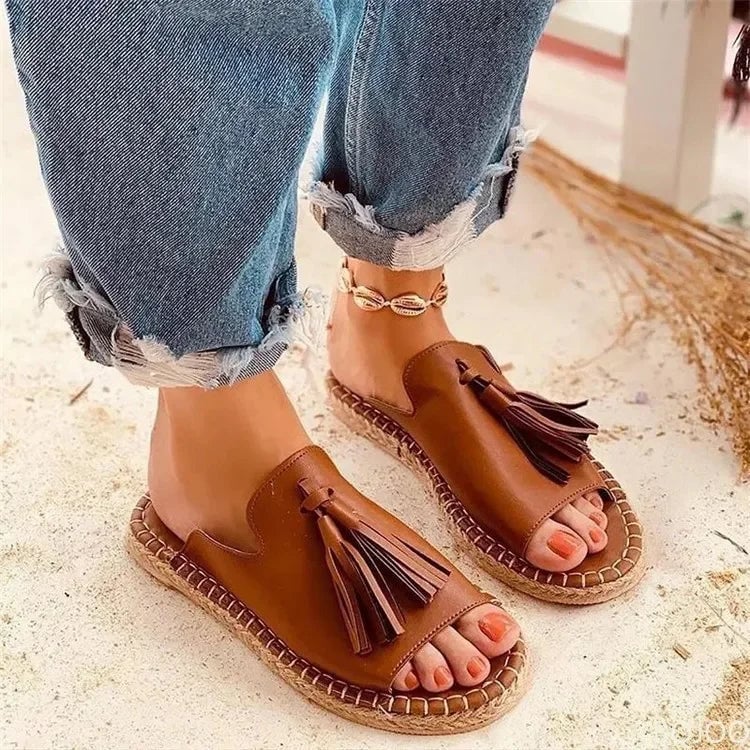 Model wearing Azalea woven slides in black paired with a casual summer outfit