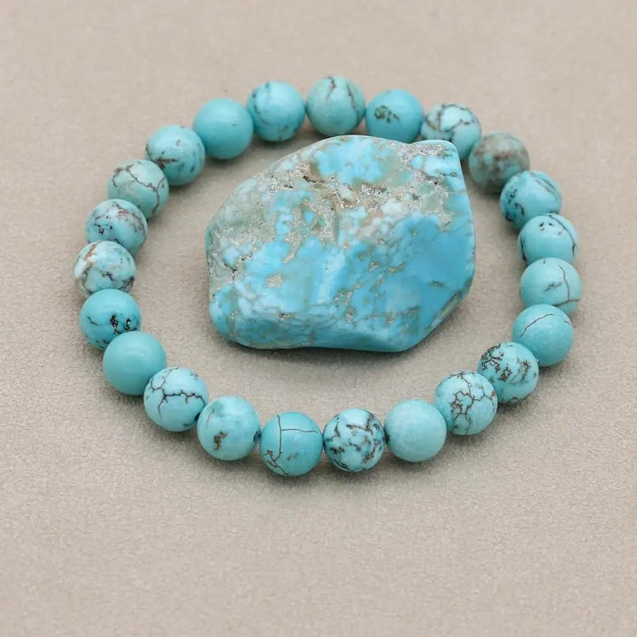 Turquoise statement bracelet displayed on a neutral background