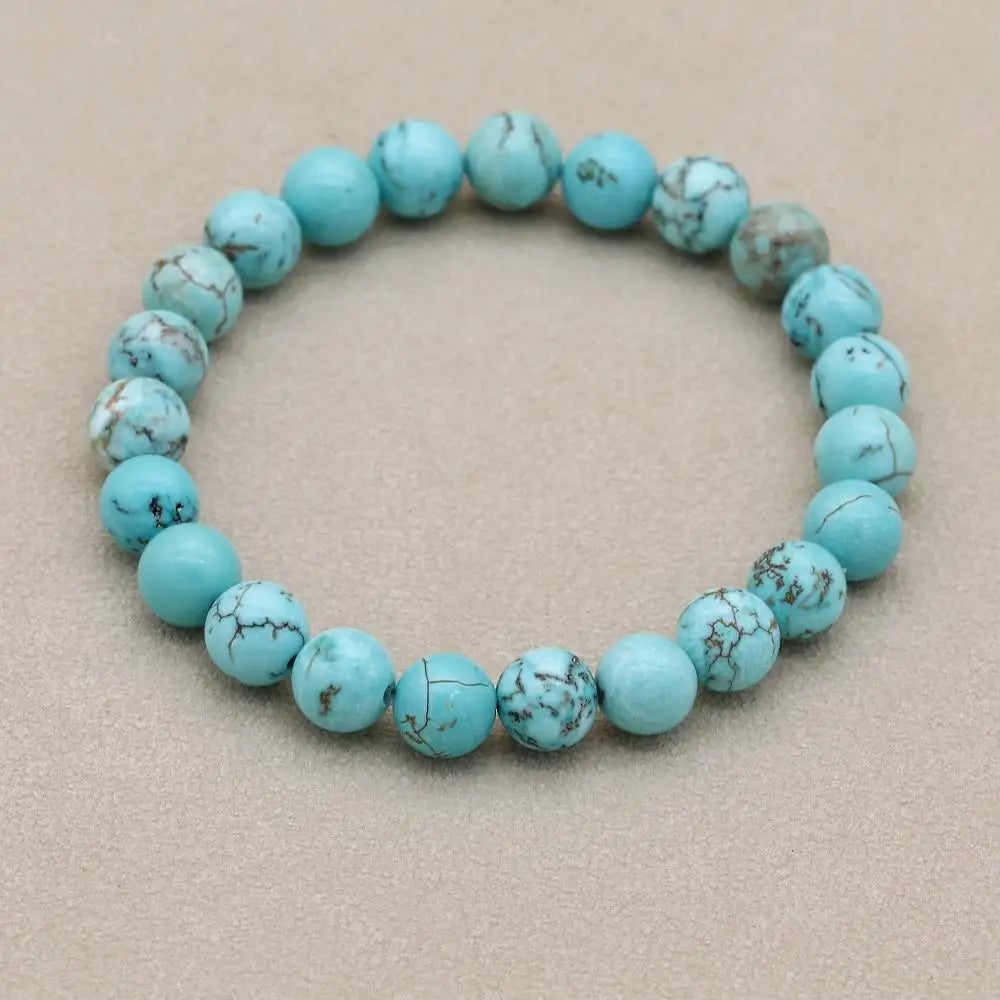 Turquoise bracelet flat lay with complementary accessories