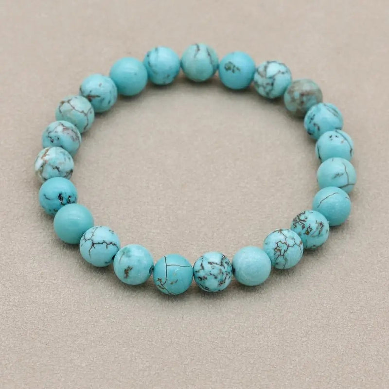 Turquoise bracelet flat lay with complementary accessories