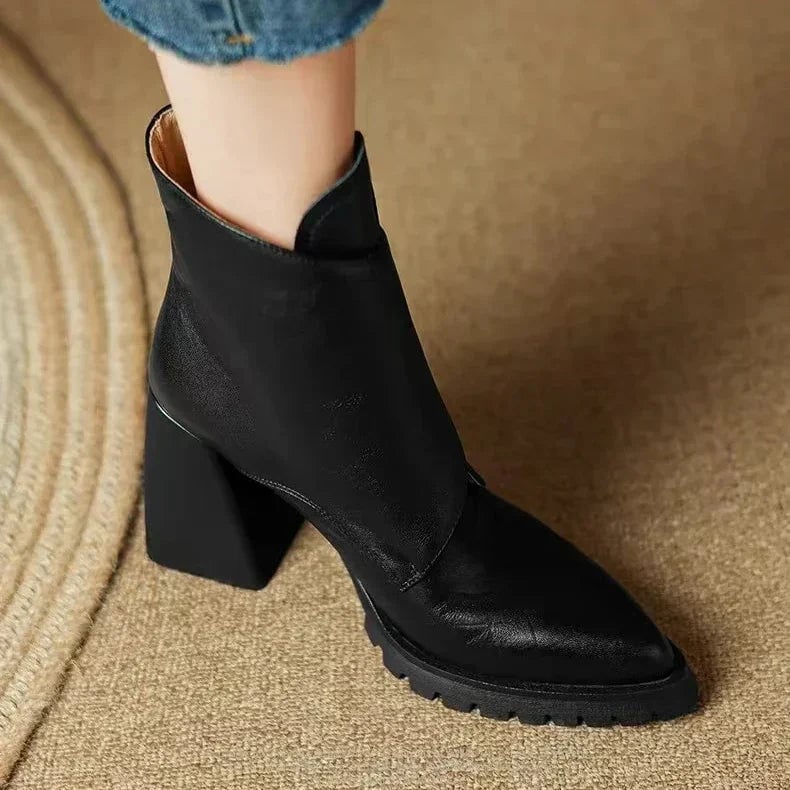 Side profile of the Florimay Aziel boot showing streamlined silhouette in black