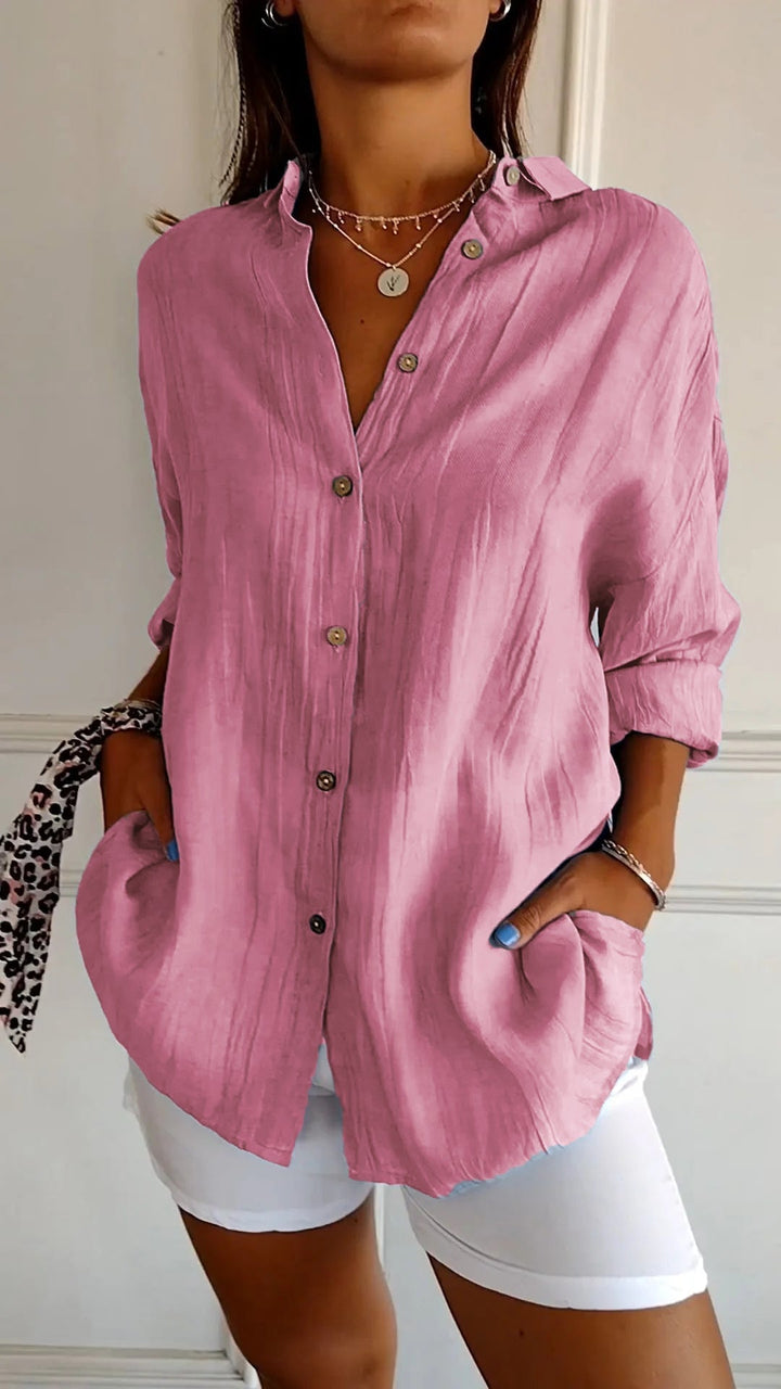 Back view of the Azure linen-look shirt in blue highlighting the crinkle texture and boxy fit