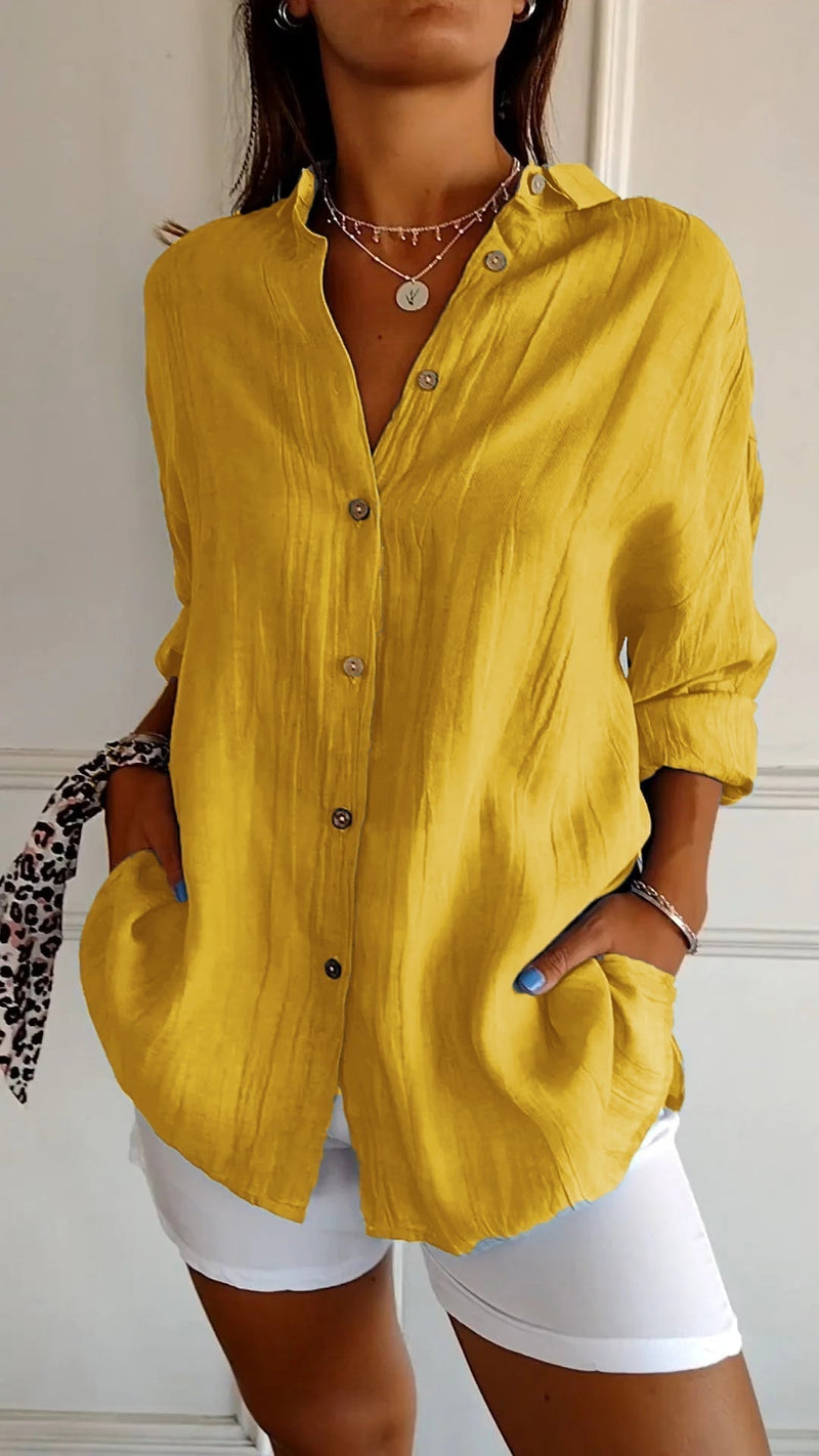 Close-up of the wooden-tone buttons and spread collar detail on the Azure casual shirt