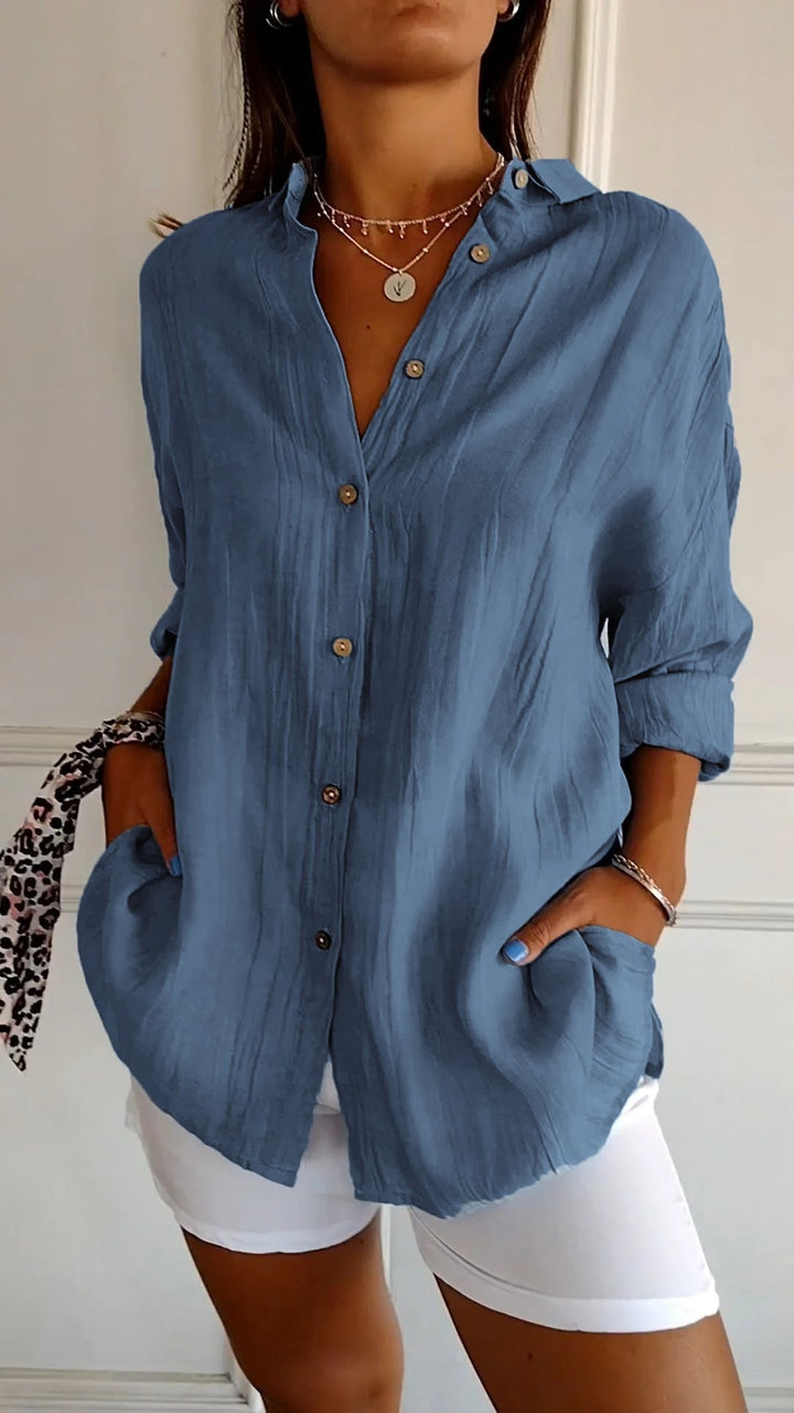 Model wearing the Azure oversized shirt in brown with sleeves rolled to forearm