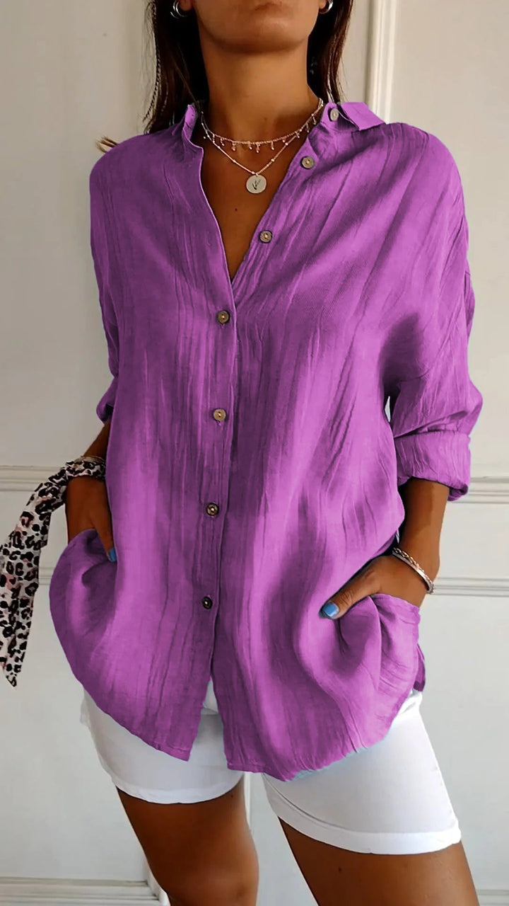 Model wearing the Azure oversized shirt in dark green with relaxed rolled sleeves
