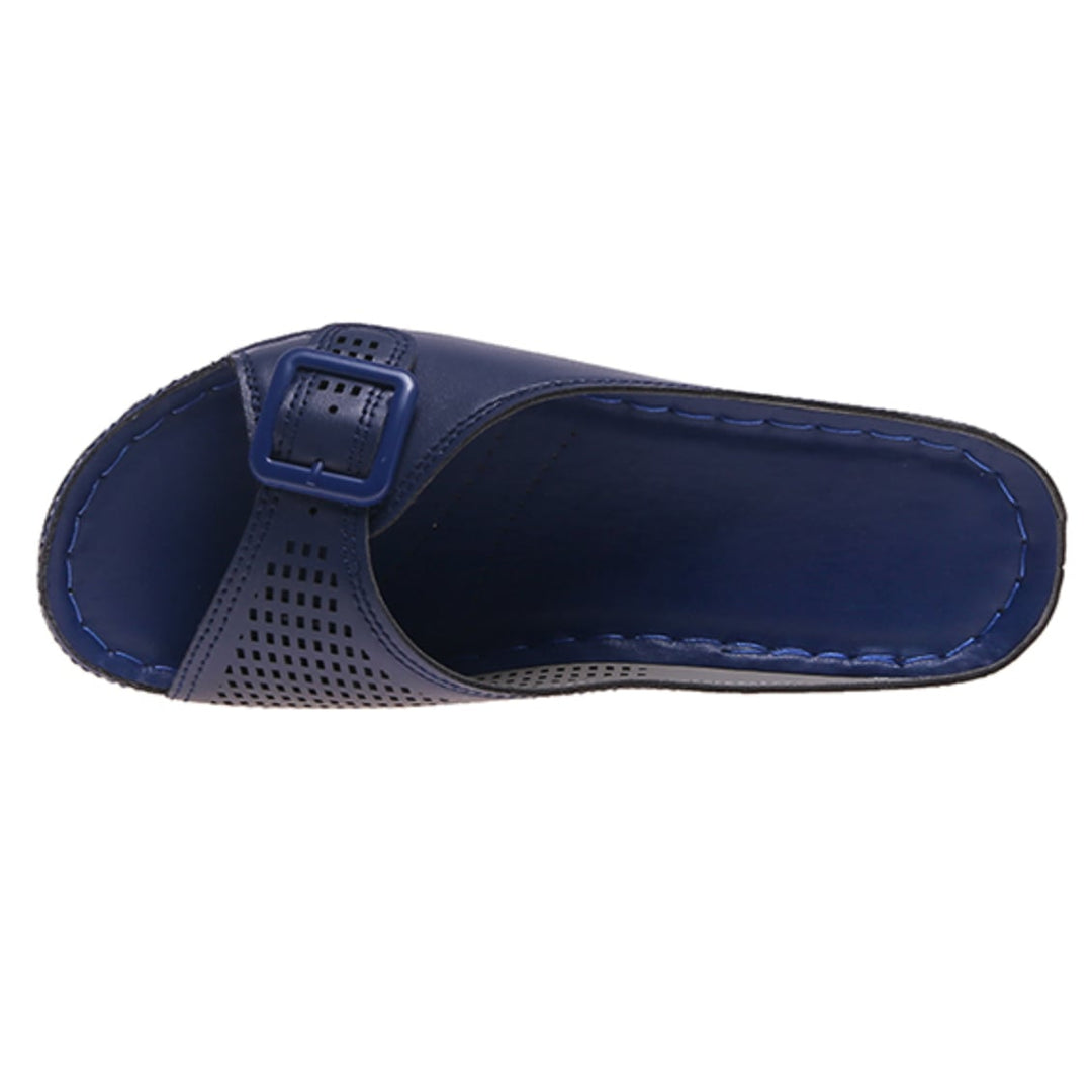 Babette orthopedic flat sandal in dark blue styled with a flowy dress on a model