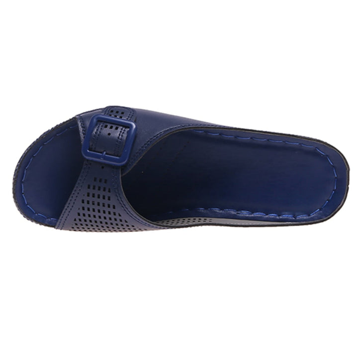 Babette orthopedic flat sandal in dark blue styled with a flowy dress on a model