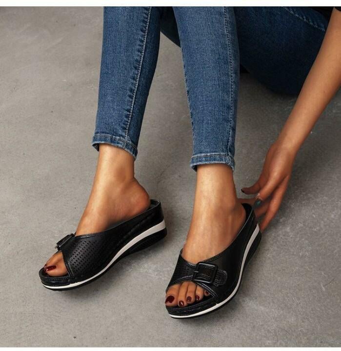 Babette orthopedic flat sandal in black worn on foot showing fit and silhouette